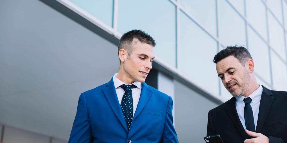 businessmen-talking-each-other