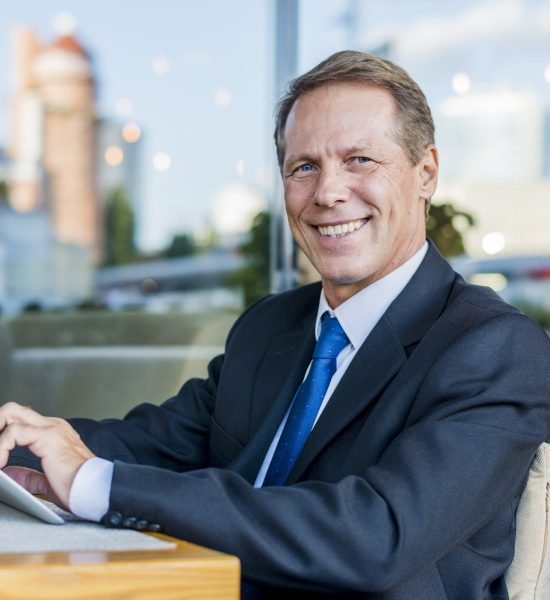 portrait-happy-mature-businessman-using-digital-tablet-restaurant portrait-happy-mature-businessman-using-digital-tablet-restaurant